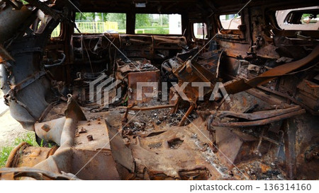 Rusty and burned-out armored vehicles on ukrainian territory. Exhibition of destroyed military equipment of the russian army. War between Ukraine and russia. Close up Slow motion 136314160