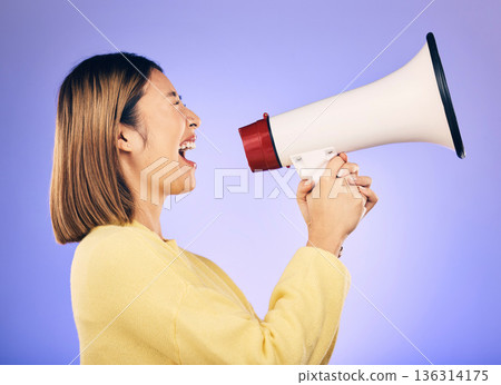 Megaphone, voice and young woman with human rights, equality and freedom of speech or strong opinion. Person protest, call to action and change or justice with noise on studio or purple background Megaphone, voice and young woman with human rights, equality and freedom of speech or strong opinion. Person protest, call to action and change or justice with noise on studio or purple background 136314175