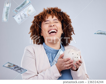 Happy woman with money rain, piggy bank and savings in studio, finance and budget with dollar investment. Happiness, growth and cash profit, salary bonus for girl with money box on white background. Happy woman with money rain, piggy bank and savings in studio, finance and budget with dollar investment. Happiness, growth and cash profit, salary bonus for girl with money box on white background. 136314244