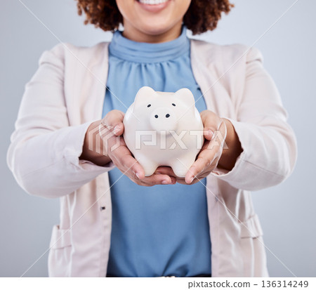 Hands of woman with piggy bank, savings in studio and finance and budget planning with investment loan. Financial freedom, growth and profit, salary management girl with money box on white background Hands of woman with piggy bank, savings in studio and finance and budget planning with investment loan. Financial freedom, growth and profit, salary management girl with money box on white background 136314249