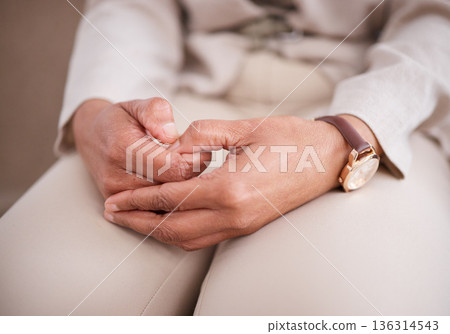 Hands, depression or anxiety with a woman patient closeup on a sofa for mental health or psychology. Stress, healthcare and medical with a nervous female person sitting in an office of a psychologist Hands, depression or anxiety with a woman patient closeup on a sofa for mental health or psychology. Stress, healthcare and medical with a nervous female person sitting in an office of a psychologist 136314543