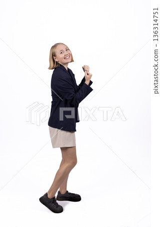 Businesswoman in suit jacket thinking and looking away 136314751