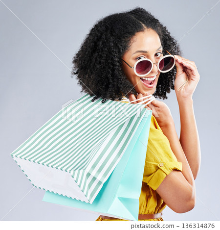 Shopping, bag and portrait of woman excited for retail sale, promotion or discount on studio, mockup or grey background. Wow, customer and girl to shop for fashion or sales on luxury clothing Shopping, bag and portrait of woman excited for retail sale, promotion or discount on studio, mockup or grey background. Wow, customer and girl to shop for fashion or sales on luxury clothing 136314876