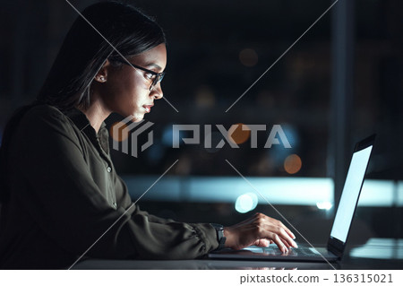 Laptop, research and business woman in coding, software development and programming for night cybersecurity. Computer, typing and screen reflection, focus and data analysis of programmer or IT person 136315021