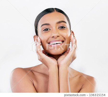Beauty, skin and face portrait of a happy woman with natural glow isolated on a white background. Dermatology, makeup and cosmetics of Indian female model for facial shine or self care in studio Beauty, skin and face portrait of a happy woman with natural glow isolated on a white background. Dermatology, makeup and cosmetics of Indian female model for facial shine or self care in studio 136315154