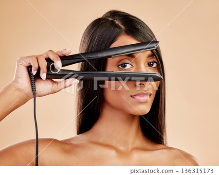 Flat iron, hair and woman with beauty, portrait and hairstyle with appliance isolated on studio background. Keratin treatment, electric straightener and heat, Indian female model with cosmetology Flat iron, hair and woman with beauty, portrait and hairstyle with appliance isolated on studio background. Keratin treatment, electric straightener and heat, Indian female model with cosmetology 136315173
