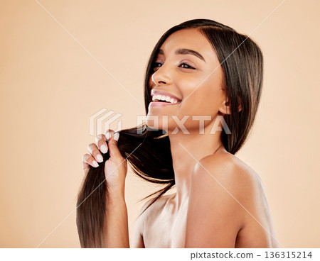 Beauty, hair care and woman laughing in studio with natural glow and shine. Hairstyle, cosmetics and wellness of a happy Indian person for hairdresser, makeup or salon results on a beige background Beauty, hair care and woman laughing in studio with natural glow and shine. Hairstyle, cosmetics and wellness of a happy Indian person for hairdresser, makeup or salon results on a beige background 136315214