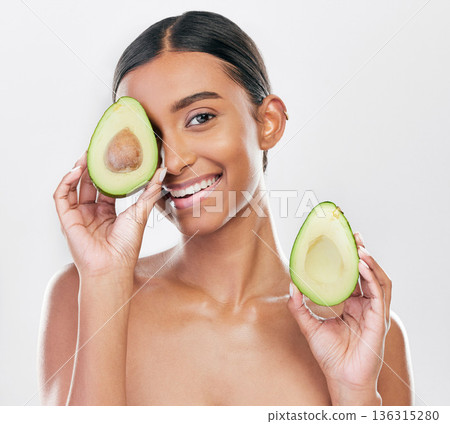 Face, avocado and natural beauty, woman with organic cosmetics and facial on white background. Eco friendly skincare, healthy skin glow and female model in portrait, fruit and dermatology in studio Face, avocado and natural beauty, woman with organic cosmetics and facial on white background. Eco friendly skincare, healthy skin glow and female model in portrait, fruit and dermatology in studio 136315280