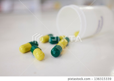 Pills, medication and capsules of pharmaceutical drugs on table for cure, pain or remedy at the clinic. Closeup of healthcare or medical tablets on desk at pharmacy for products, dose or inventory Pills, medication and capsules of pharmaceutical drugs on table for cure, pain or remedy at the clinic. Closeup of healthcare or medical tablets on desk at pharmacy for products, dose or inventory 136315339