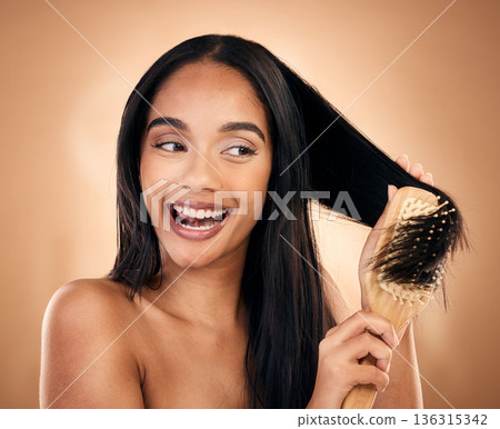Hair care, brush and excited woman with beauty in studio isolated on a brown background. Salon, happy and model with wood grooming product for natural aesthetic, hairdresser or hairstyle for wellness Hair care, brush and excited woman with beauty in studio isolated on a brown background. Salon, happy and model with wood grooming product for natural aesthetic, hairdresser or hairstyle for wellness 136315342