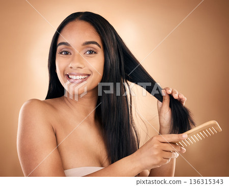 Hair care, comb and portrait of woman, smile and isolated on a brown background in studio. Salon, face and beauty of model with a product for natural aesthetic, hairdresser and hairstyle for wellness Hair care, comb and portrait of woman, smile and isolated on a brown background in studio. Salon, face and beauty of model with a product for natural aesthetic, hairdresser and hairstyle for wellness 136315343