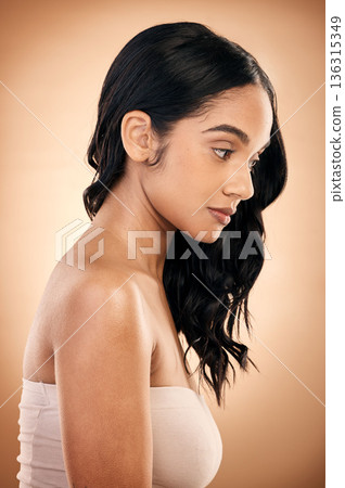 Thinking, texture and woman with hair care, salon treatment and self care against a brown studio background. Female person, girl and model with ideas, aesthetic and skincare with beauty and luxury 136315349