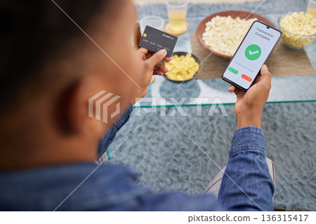Credit card, man and phone screen for online shopping, sale and home streaming subscription payment, transaction or membership. Ecommerce, banking and male with smartphone app for eft or savings Credit card, man and phone screen for online shopping, sale and home streaming subscription payment, transaction or membership. Ecommerce, banking and male with smartphone app for eft or savings 136315417