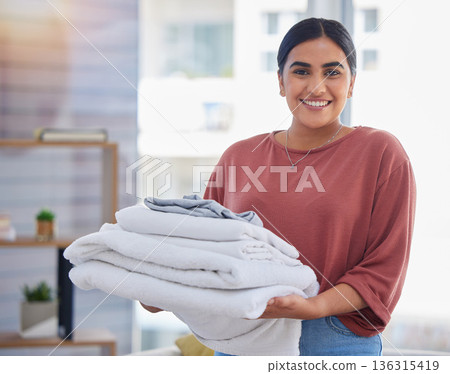 Cleaning, laundry and portrait of woman in living room for housekeeping service, clothes and fabric. Hospitality, happy and cleaner with person at home for maintenance, helping and washing Cleaning, laundry and portrait of woman in living room for housekeeping service, clothes and fabric. Hospitality, happy and cleaner with person at home for maintenance, helping and washing 136315419