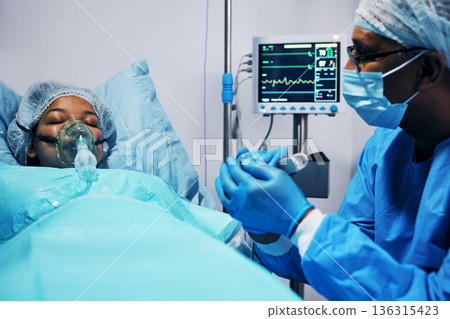 Healthcare, doctor and patient holding hands in hope after surgery, emergency care and hospital bed. Breathing, monitor and air, surgeon with helping hand in operation, support for medical results. 136315423