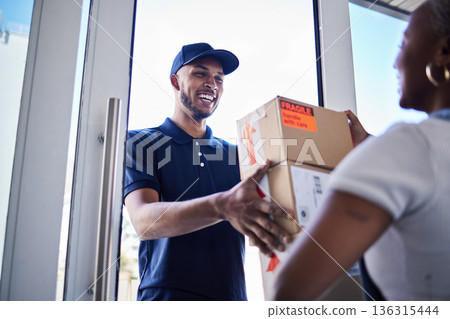 Ecommerce, happy delivery man with box and woman at her front door. Online shopping or logistics, supply chain or distribution and African female person receive her cardboard parcel with smile Ecommerce, happy delivery man with box and woman at her front door. Online shopping or logistics, supply chain or distribution and African female person receive her cardboard parcel with smile 136315444