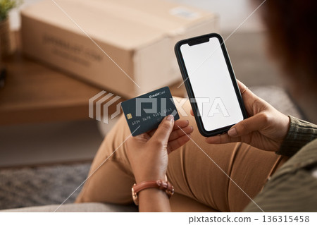 Hands of woman, credit card and mockup phone screen for online shopping, digital payment and fintech account at home. Closeup, banking app and mobile space for money, web sales and financial password 136315458