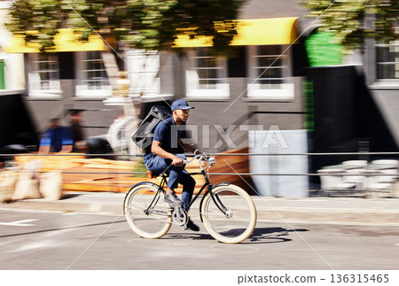 Transportation, delivery on bicycle with package and city street for logistics. Eco friendly transport or distribution service, bike courier and male person with parcel for customer service in road 136315465