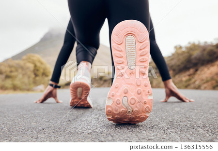 Feet, person and running fitness for workout, training and exercise with sport and active in nature. Athlete sprint and road by a mountain outdoor ready to start a run for health and wellness. Feet, person and running fitness for workout, training and exercise with sport and active in nature. Athlete sprint and road by a mountain outdoor ready to start a run for health and wellness. 136315556