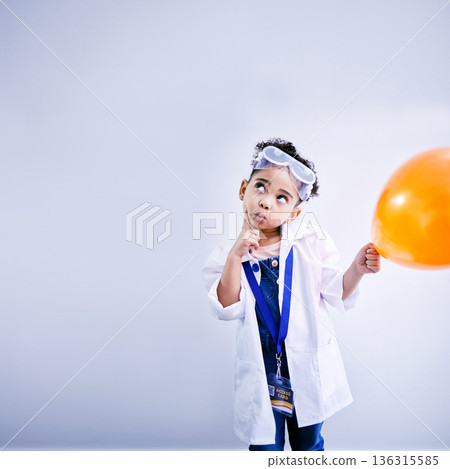 Child, thinking and balloon science in studio with .hand on chin, goggles and idea. African kid student with solution or problem solving, education or fun biology experiment on a white background 136315585