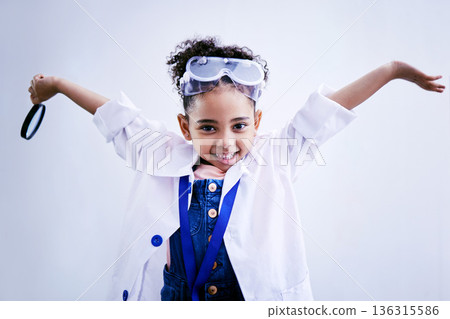 Child, happy and portrait of a scientist girl in studio with open hands, glasses and a magnifier. Face of a African kid student excited for medical science, education or biology experiment for future Child, happy and portrait of a scientist girl in studio with open hands, glasses and a magnifier. Face of a African kid student excited for medical science, education or biology experiment for future 136315586