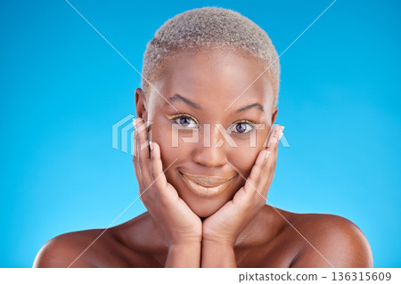 Face, makeup portrait and happy black woman with aesthetic eyeliner, studio cosmetics and luxury skincare glow. Facial beauty confidence, wellness smile and female African model on blue background. Face, makeup portrait and happy black woman with aesthetic eyeliner, studio cosmetics and luxury skincare glow. Facial beauty confidence, wellness smile and female African model on blue background. 136315609