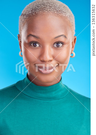 Portrait, cosmetics and black woman with confidence, smile or pride in blue studio background. Beauty, face and african female with makeup and positive mindset for fashion for wellness or glow. 136315632