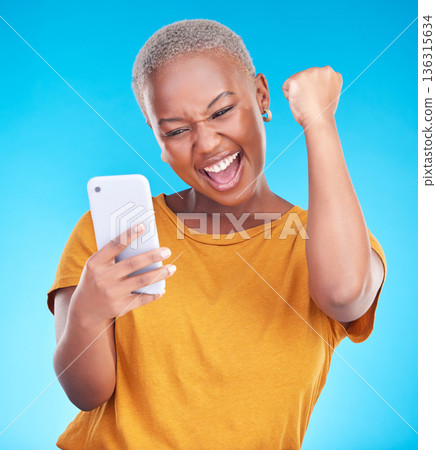 Surprise, phone and happy black woman excited for announcement, winner notification or good news, alert or promo. Winning, cellphone info and studio person shocked, cheers or wow on blue background Surprise, phone and happy black woman excited for announcement, winner notification or good news, alert or promo. Winning, cellphone info and studio person shocked, cheers or wow on blue background 136315634