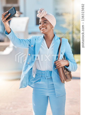 Black business woman, selfie and smile in street with fashion, beauty and post for social network app. Happy African entrepreneur, photography and profile picture for web blog with suit in metro cbd Black business woman, selfie and smile in street with fashion, beauty and post for social network app. Happy African entrepreneur, photography and profile picture for web blog with suit in metro cbd 136315692