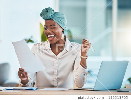 Laptop, documents and wow with a business black woman in celebration while reading her promotion contract. Success, motivation and paper with a young female employee cheering as a winner in an office 136315705