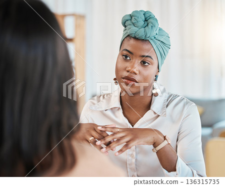 Business people, conversation and meeting or interview in office with a black woman as leader. Face of African female entrepreneur with employee to listen to advice, idea or communication at work 136315735