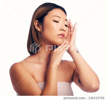 Skincare, beauty and face of Asian woman on a white background for wellness, spa and cosmetics. Dermatology, salon and isolated female person with perfect skin, satisfaction and facial care in studio 136315793