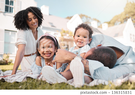 Love, blended family and parents on the lawn with their children in the garden of their home together. Mother, father and portrait of kids sitting on the grass in the yard of their house for bonding Love, blended family and parents on the lawn with their children in the garden of their home together. Mother, father and portrait of kids sitting on the grass in the yard of their house for bonding 136315831