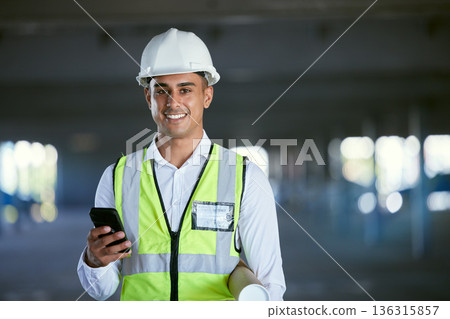 Architect, phone and portrait of happy man in warehouse with blueprint, networking and communication with plan. Engineering, cellphone and construction site with safety, planning and smile on face. Architect, phone and portrait of happy man in warehouse with blueprint, networking and communication with plan. Engineering, cellphone and construction site with safety, planning and smile on face. 136315857