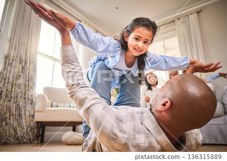 Family, fun and a daughter flying with dad on the floor of a living room in their home together for bonding. Smile, children and portrait a happy girl playing fantasy games her father in their house Family, fun and a daughter flying with dad on the floor of a living room in their home together for bonding. Smile, children and portrait a happy girl playing fantasy games her father in their house 136315889