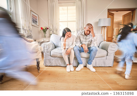 Motion blur, stress and parents with adhd children on a sofa in the living room of their home feeling burnout. Family, kids running or playing with a mom and dad eyes closed in a house for a break Motion blur, stress and parents with adhd children on a sofa in the living room of their home feeling burnout. Family, kids running or playing with a mom and dad eyes closed in a house for a break 136315898