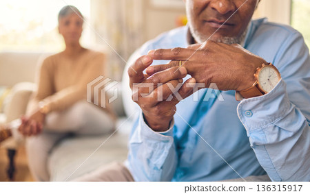 Elderly couple, hands and ring in divorce, fight or conflict from disagreement or argument on sofa at home. Senior man and woman in depression, infertility or cheating and toxic marriage in the house 136315917