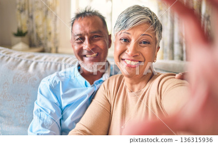 Selfie, home and senior couple with love, relax and happiness with romance, bonding and marriage. Portrait, old man and elderly woman on a couch, social media and profile picture with a relationship 136315936