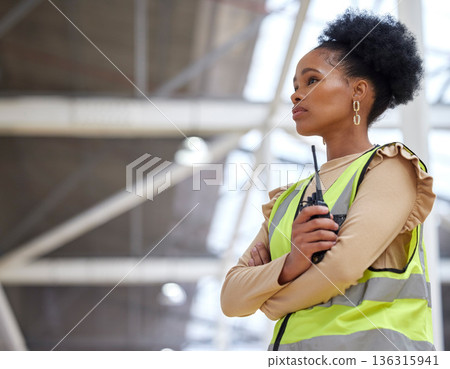 Woman, construction and walkie talkie at worksite for project with inspection at building with planning. Architect, girl and radio for contractor or leadership and worker with technology or ideas. 136315941