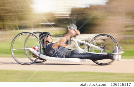 Cycling, speed and man with disability in race training for competition with action, motivation and exercise on bike. Energy, workout and person on recumbent bicycle on fast outdoor track challenge. 136316117