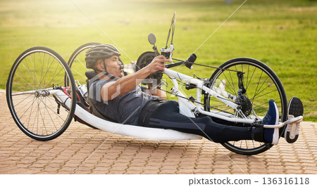 Fitness, cycling and a man with a disability and on a bike for training, travel and exercise in nature. Sports, street and a person in a wheelchair bicycle for a workout, health or cardio in a park Fitness, cycling and a man with a disability and on a bike for training, travel and exercise in nature. Sports, street and a person in a wheelchair bicycle for a workout, health or cardio in a park 136316118