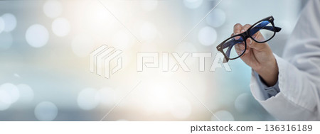 Mockup banner, glasses and hand of an optometrist for vision, healthcare and eye care product. Space, bokeh and a doctor or optician with eyewear recommendation or showing for medical optometry Mockup banner, glasses and hand of an optometrist for vision, healthcare and eye care product. Space, bokeh and a doctor or optician with eyewear recommendation or showing for medical optometry 136316189