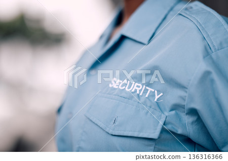 Uniform, security guard and in closeup for protection from crime with worker for safety in mock up background. Duty, service and bodyguard with uniform for patrol or defence for career at agency. Uniform, security guard and in closeup for protection from crime with worker for safety in mock up background. Duty, service and bodyguard with uniform for patrol or defence for career at agency. 136316366