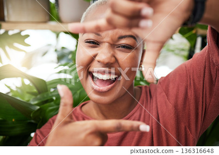 Black woman, portrait and hands in frame of face for selfie memory, vlog or social media in garden. Happy African female person with smile for photo, picture or capture moment in natural back yard Black woman, portrait and hands in frame of face for selfie memory, vlog or social media in garden. Happy African female person with smile for photo, picture or capture moment in natural back yard 136316648