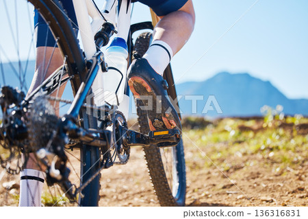 Closeup, outdoor and biker training, cycling and workout goal for wellness, road and sneakers with water bottle. Zoom, male person or cyclist with sports, nature and travel with performance or health Closeup, outdoor and biker training, cycling and workout goal for wellness, road and sneakers with water bottle. Zoom, male person or cyclist with sports, nature and travel with performance or health 136316831