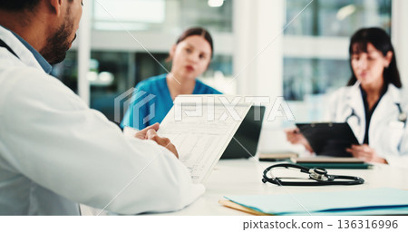 Hospital, office and doctors in meeting with clipboard for patient results, medical report and planning. Healthcare, teamwork and people with documents for consulting, discussion and surgery schedule Hospital, office and doctors in meeting with clipboard for patient results, medical report and planning. Healthcare, teamwork and people with documents for consulting, discussion and surgery schedule 136316996