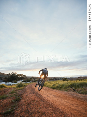 Sports, cycling and man on mountain bike in nature for training, workout and exercise in countryside. Fitness, cyclist and person with bicycle for adventure, freedom and adrenaline on dirt road Sports, cycling and man on mountain bike in nature for training, workout and exercise in countryside. Fitness, cyclist and person with bicycle for adventure, freedom and adrenaline on dirt road 136317029