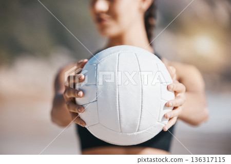 Woman, hands and volleyball in fitness for sports, game or match on beach in training or practice in nature. Hand of active and sporty female person holding ball for playing volley on ocean coast Woman, hands and volleyball in fitness for sports, game or match on beach in training or practice in nature. Hand of active and sporty female person holding ball for playing volley on ocean coast 136317115