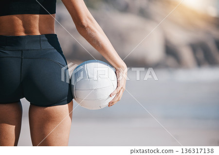 Woman, hand and volleyball on beach in sports game, match or training exercise by ocean coast. Rear view of female person with ball in fitness for volley practice by sea or healthy wellness in nature 136317138