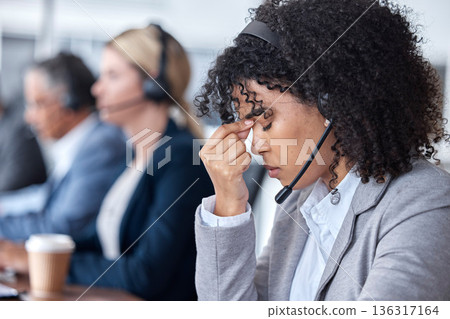 Headache, tired or woman in call center with burnout, head pain or overworked in crm communication. Migraine, office or stressed telemarketing sales agent frustrated with anxiety, fatigue or problem 136317164